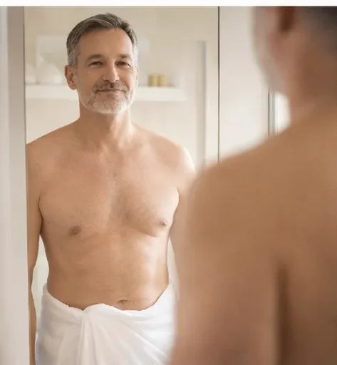A man looking at himself in the mirror